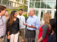 President Barchi talking to a group of students outside the new Academic building on the College Avenue Campus in New Brunswick